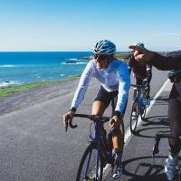 Cyclists along a coastal road